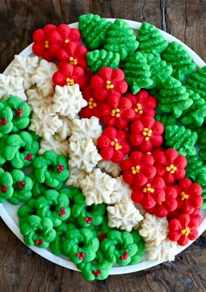 Buttery spritz cookies on a serving tray.