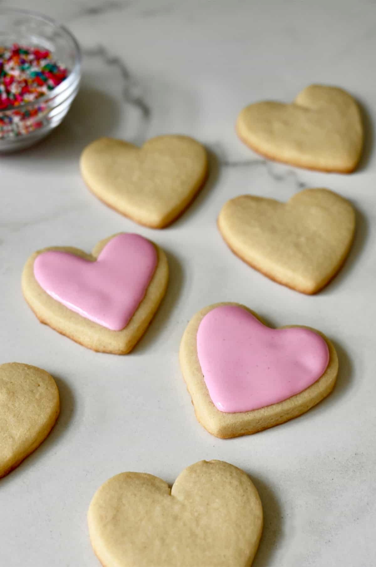 Flood icing on a heart-shaped sugar cookie.
