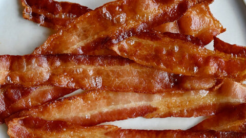 A plate full of oven-baked bacon.