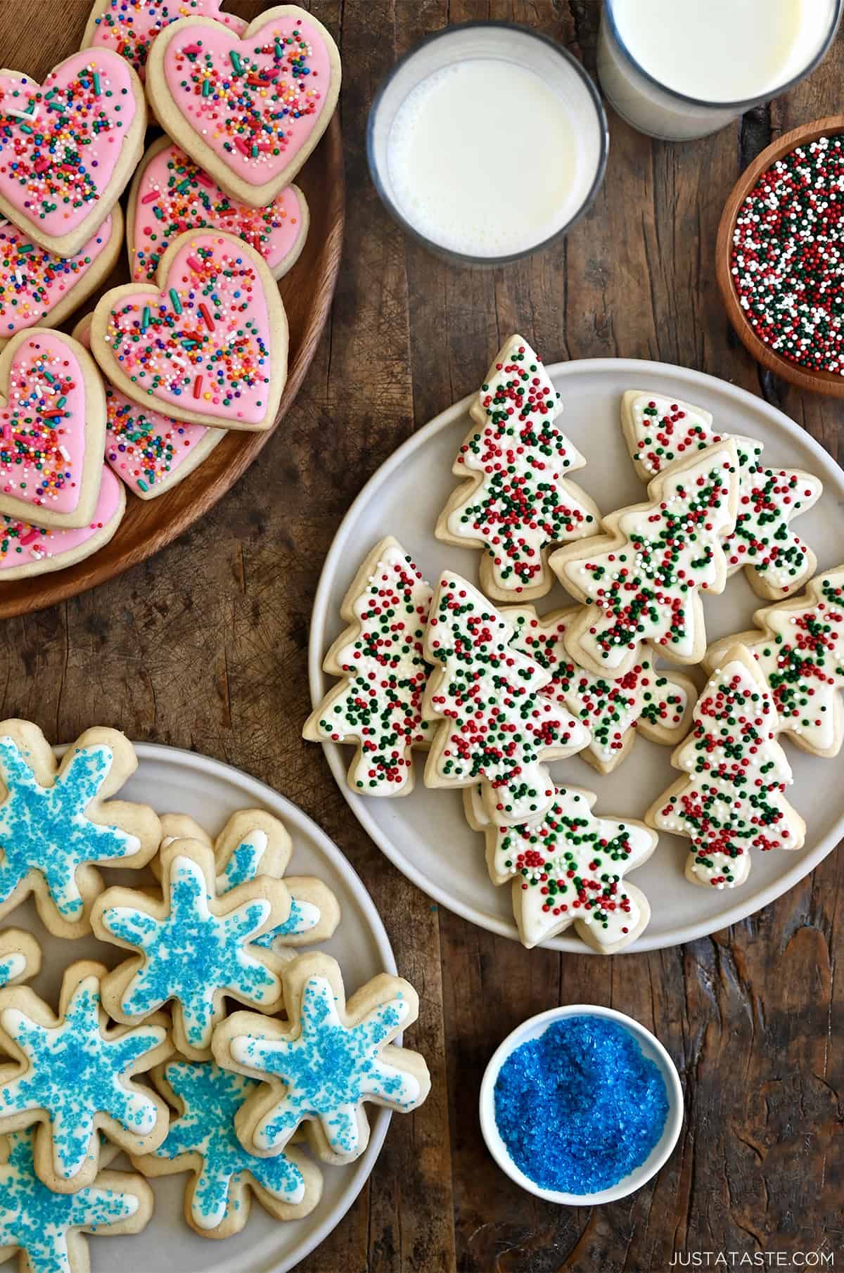 Three plates with royal icing cookies.