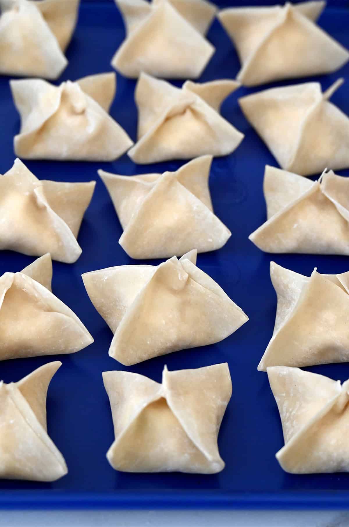 Shaped crab rangoon before deep-frying.