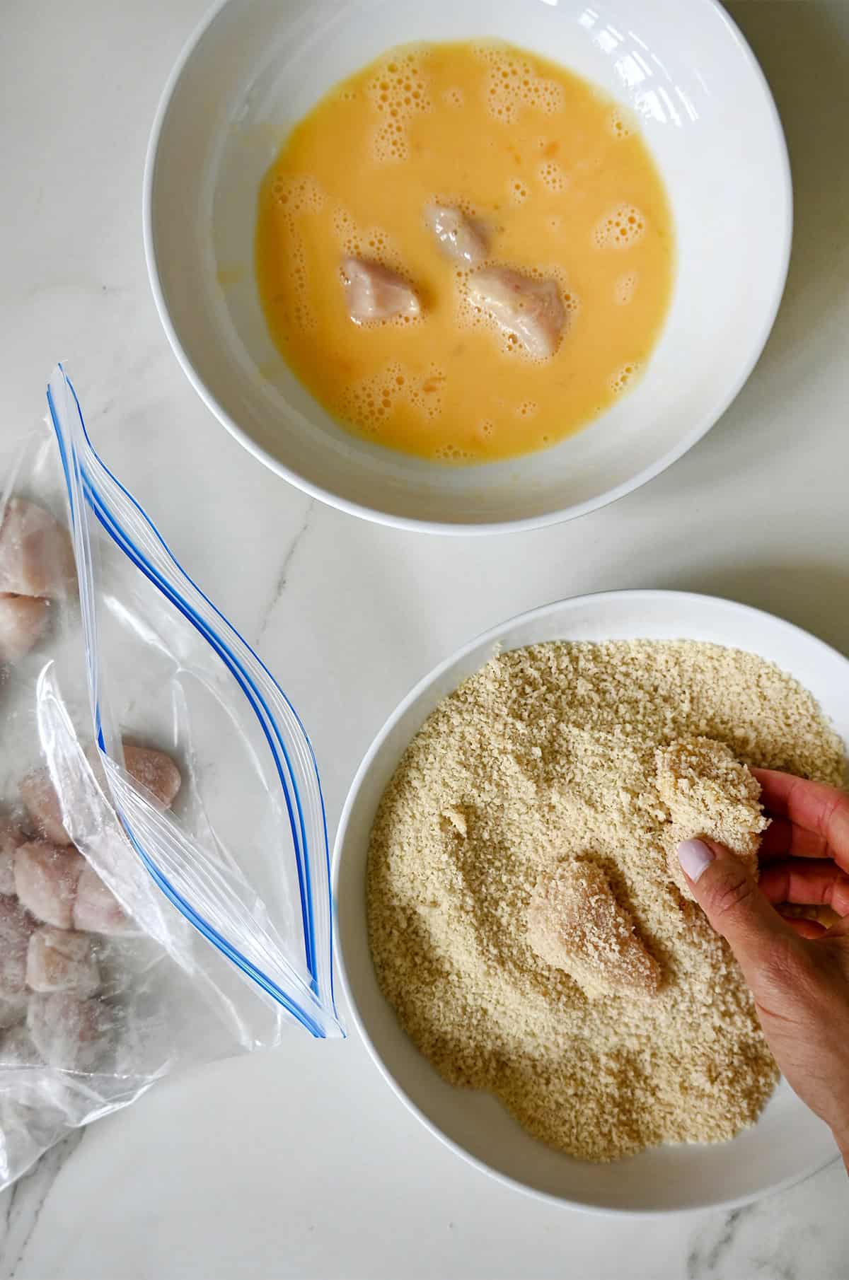 A dredging station to make battered chicken for sweet and sour chicken.