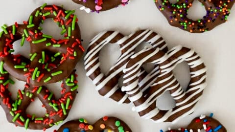 Chocolate covered pretzels with various sprinkles to match different holidays, including Christmas, Valentine's Day, 4th of July and Halloween.