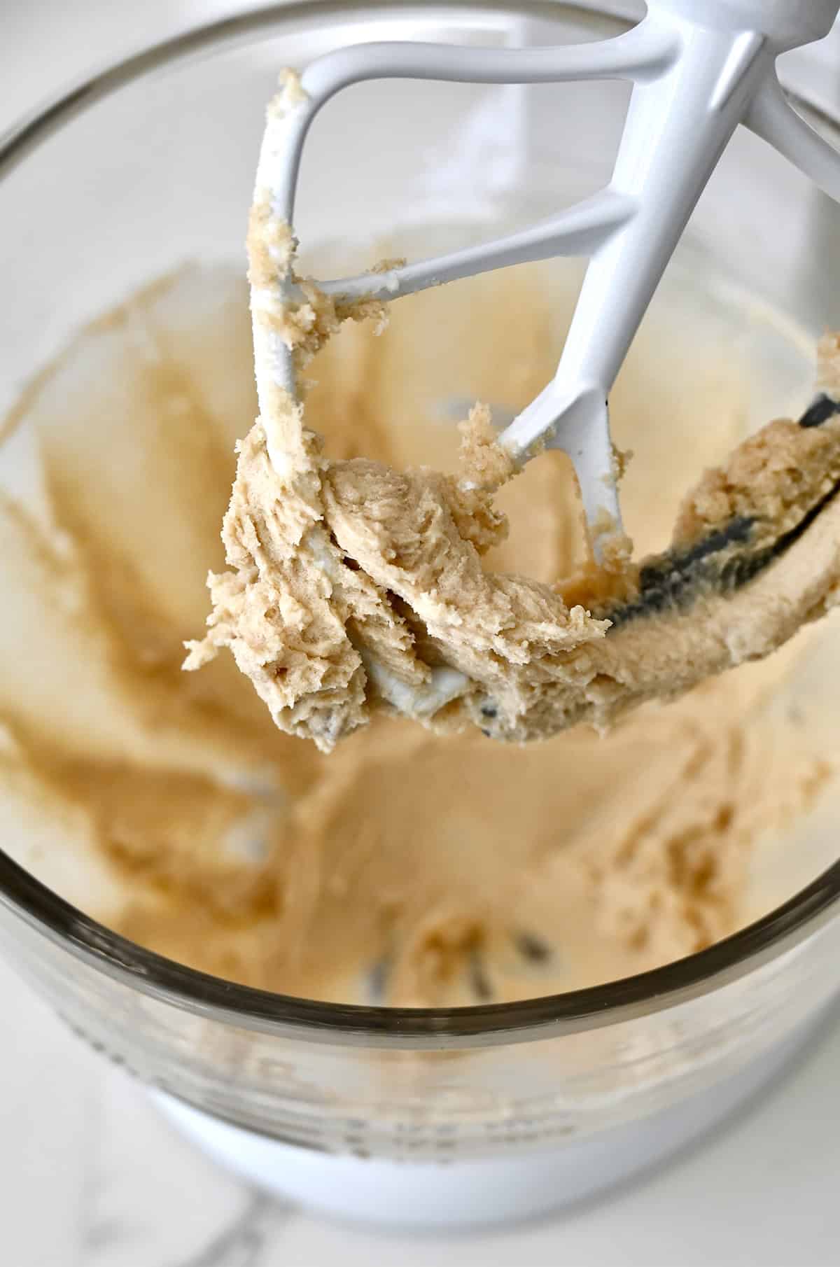 Cream butter with white and brown sugar in the bowl of a stand mixer.