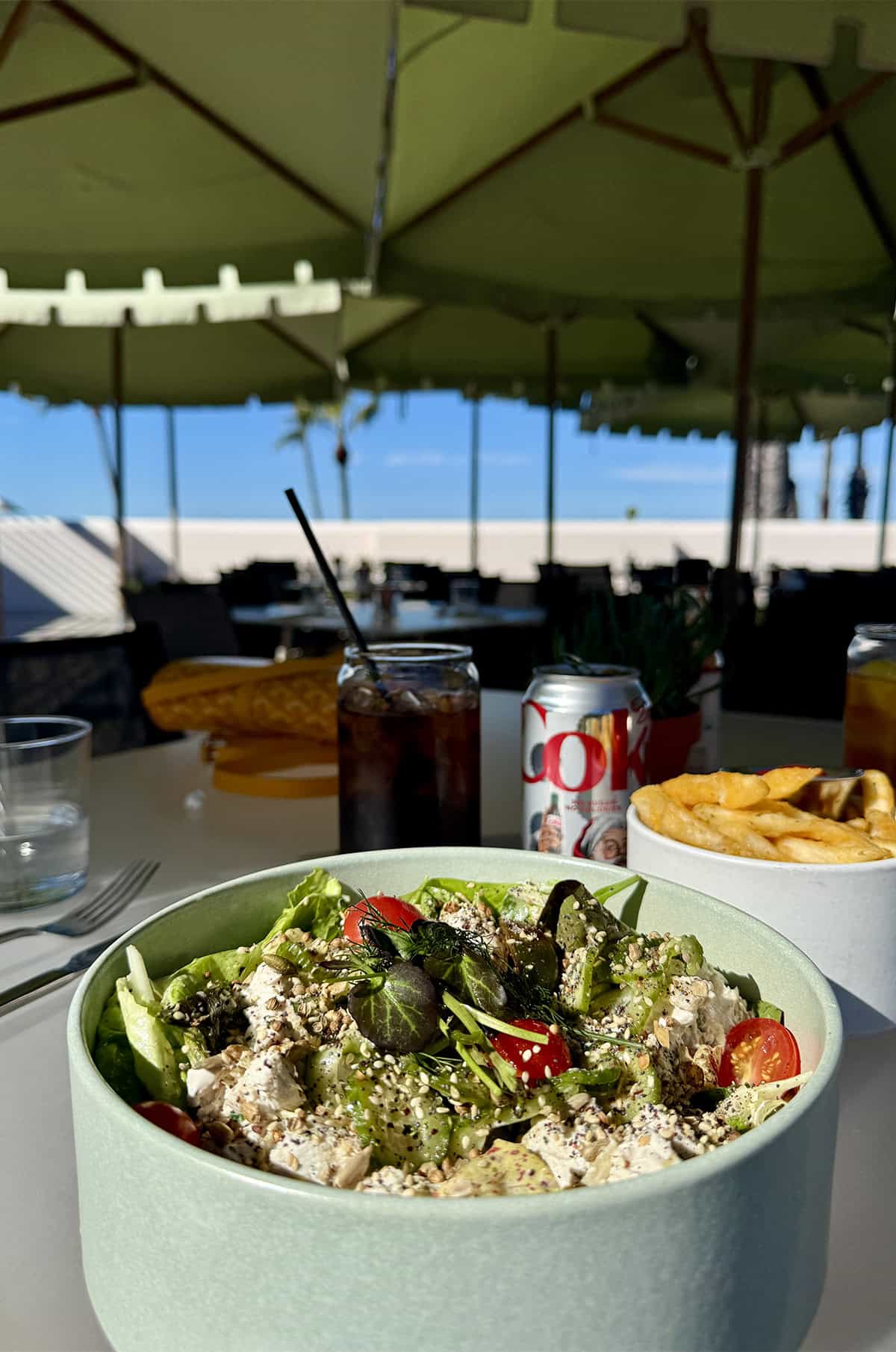 A bowl of salad with a view of blue sky