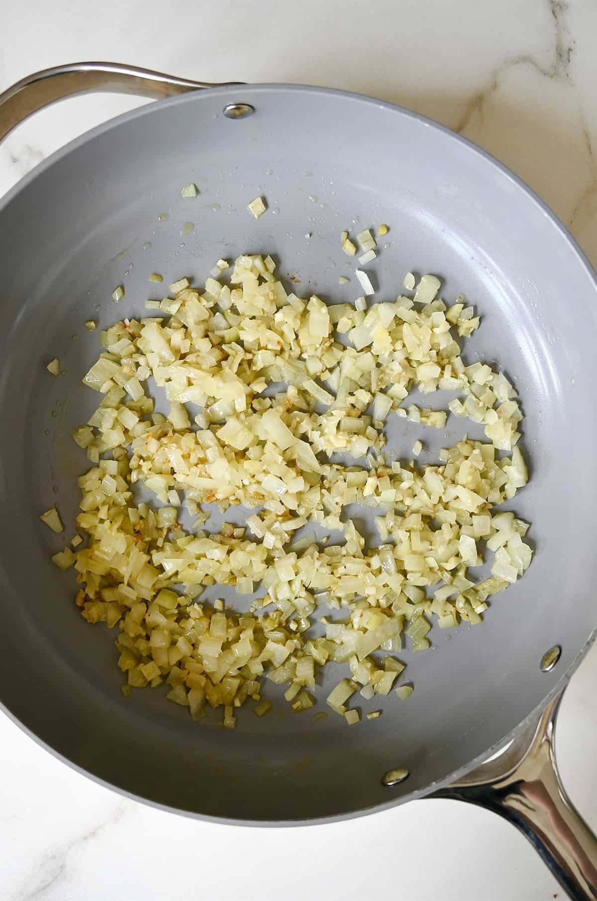 Diced sautéed onion in a large skillet.