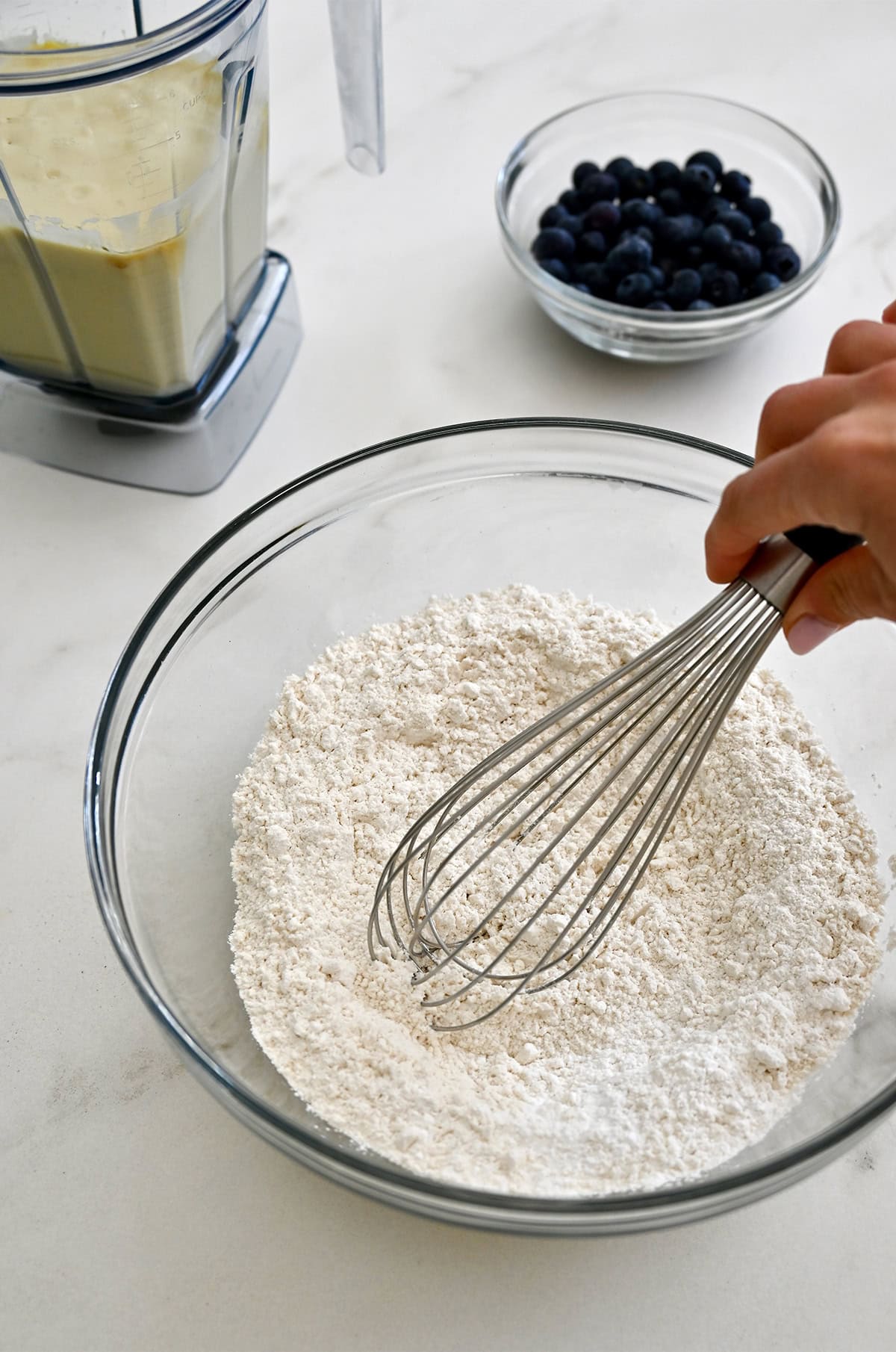 Whisking together the dry ingredients for cottage cheese muffins.