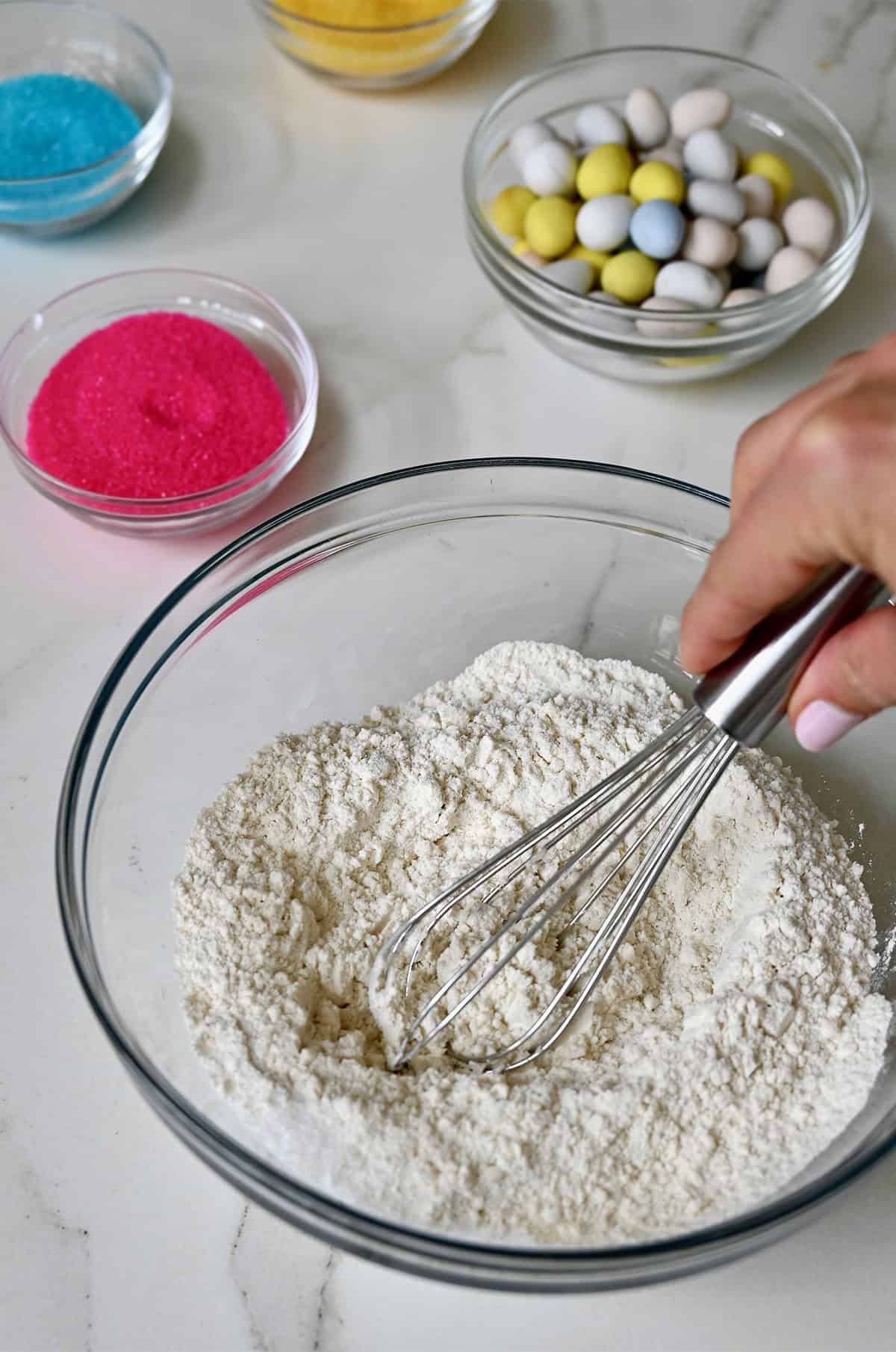 Whisking dry ingredients together for peanut butter Easter cookies.