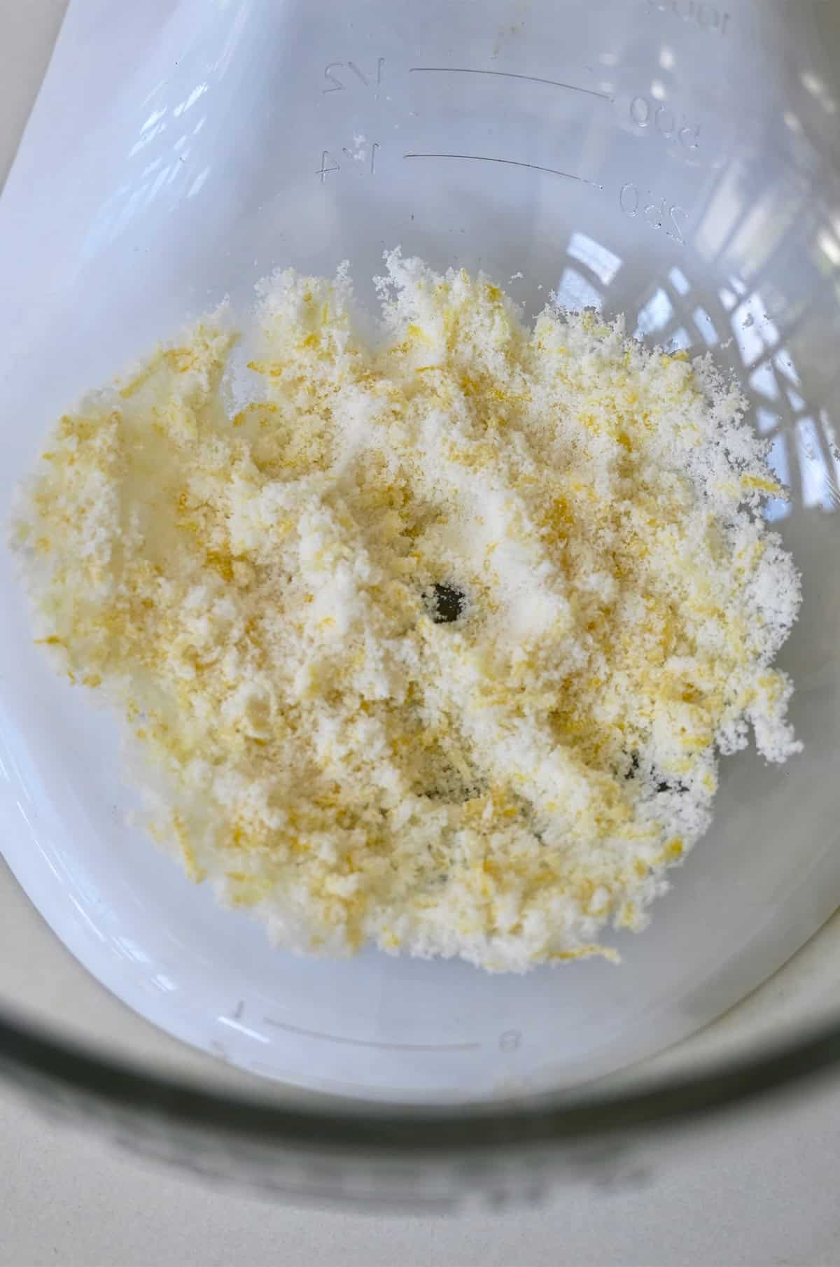 Homemade lemon sugar in a large bowl.