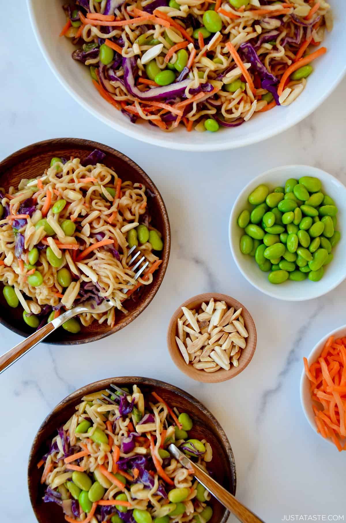 Chilled ramen noodle salad with edamame and shredded carrots, all tossed in a homemade peanut dressing.