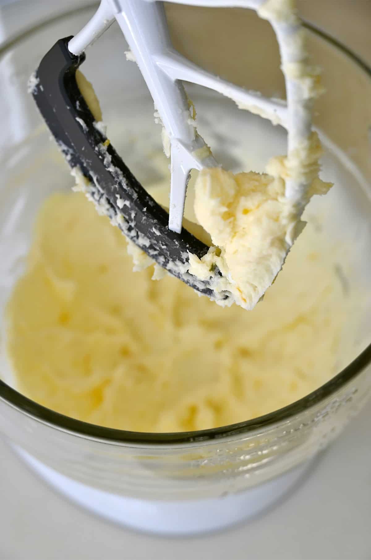 Light and fluffy creamed butter and lemon sugar in a stand mixer bowl with the paddle attachment.