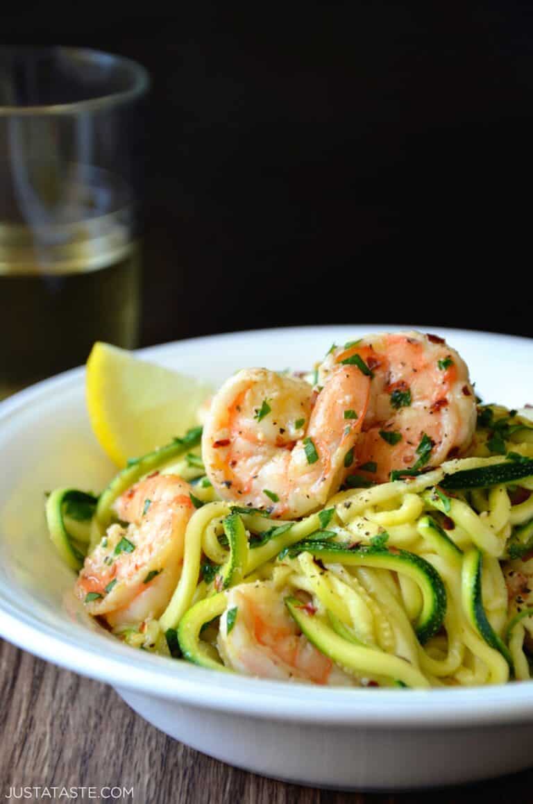 Shrimp scampi with zucchini noodles in a bowl.