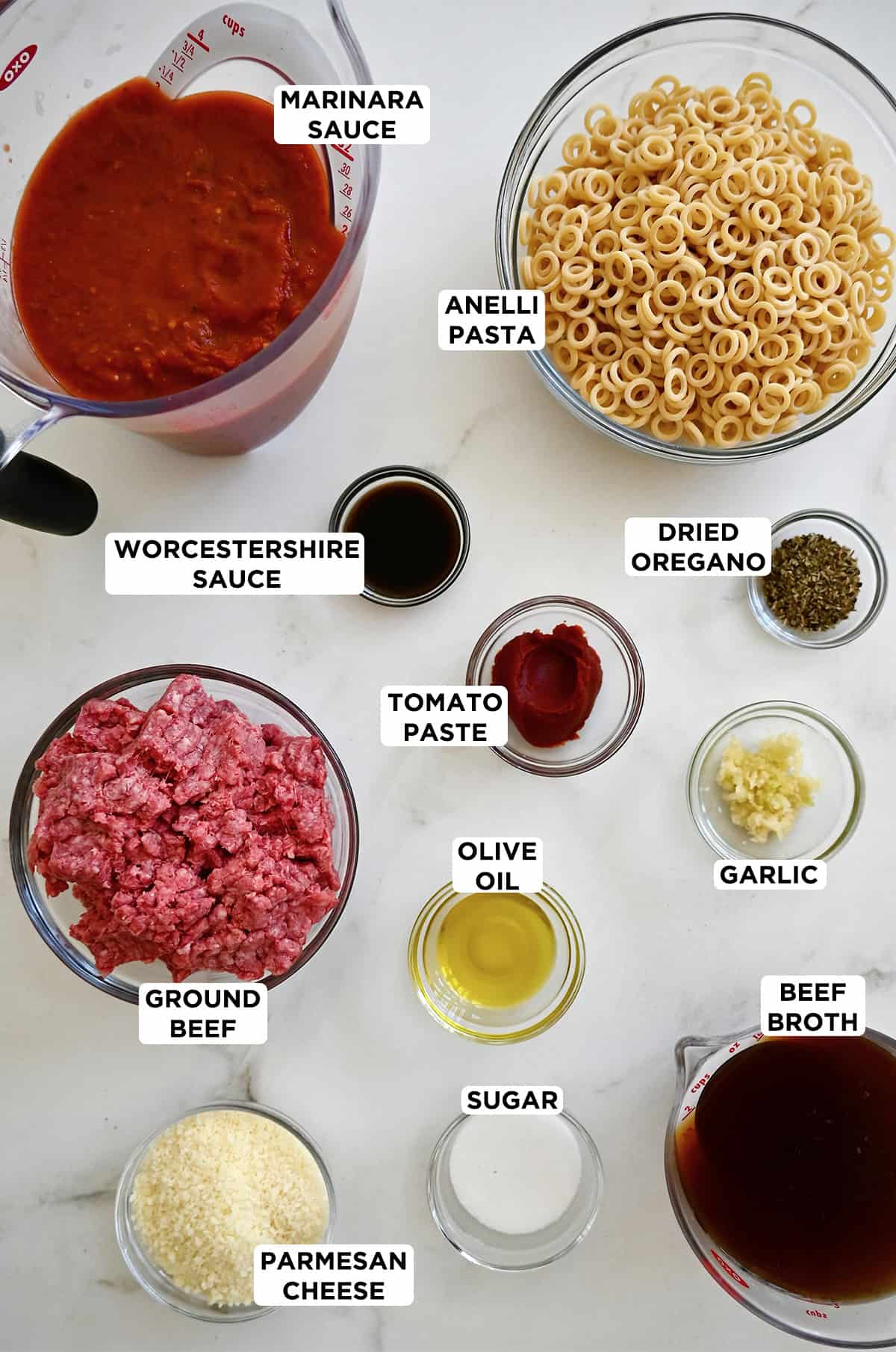 Ingredients to make homemade SpaghettiOs in various sizes of glass bowls.