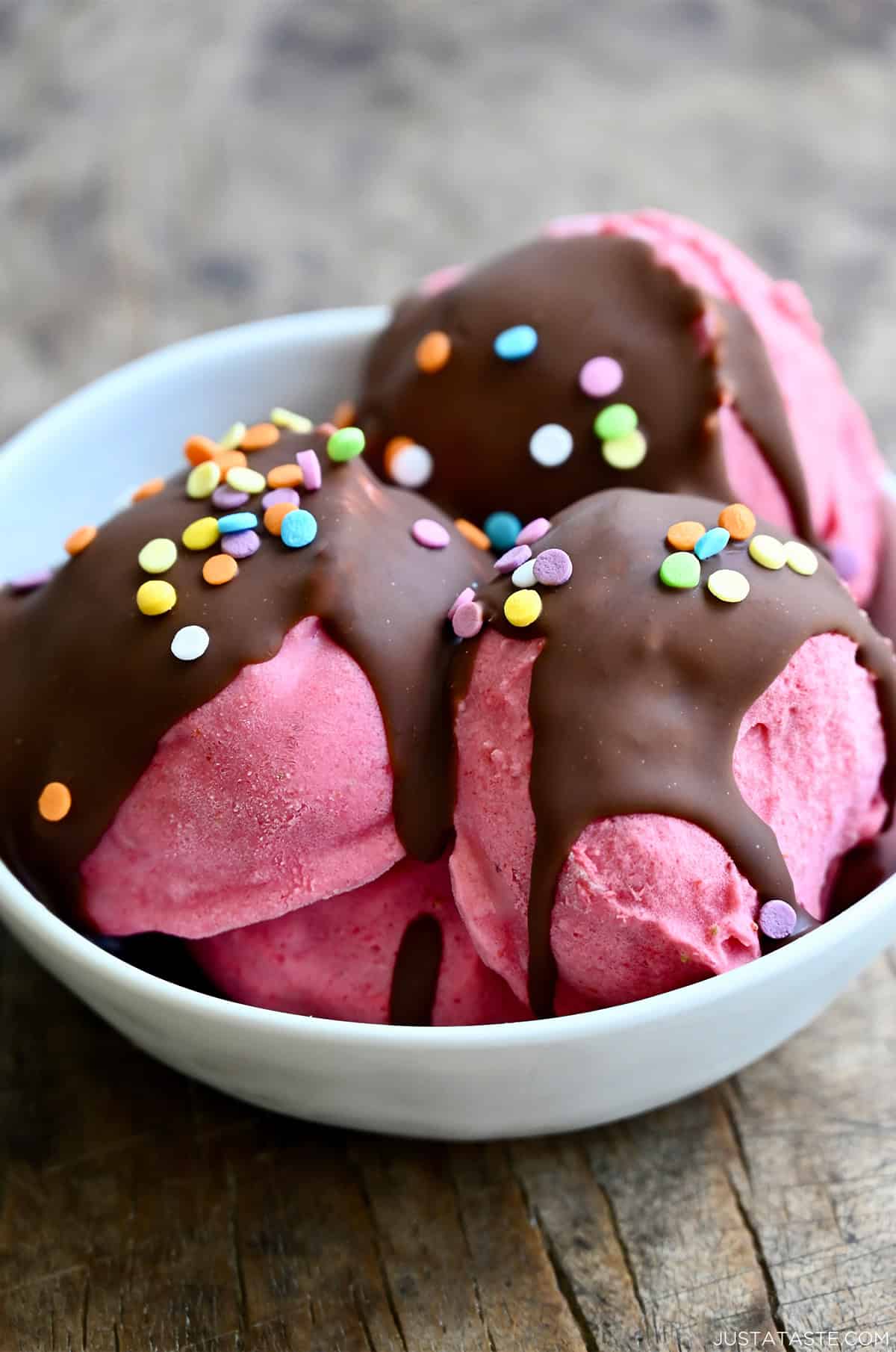Strawberry cottage cheese ice cream with a magic shell topping and sprinkles.