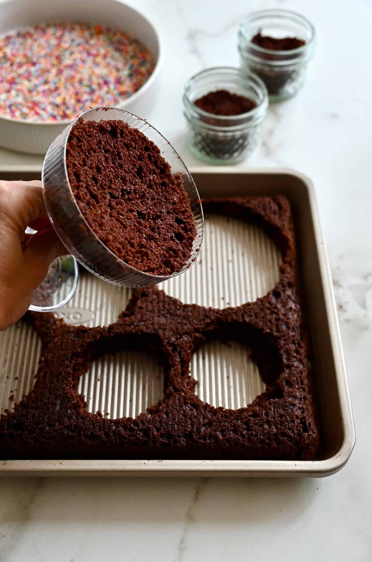Scooped cake lining the bottom of a cocktail glass.