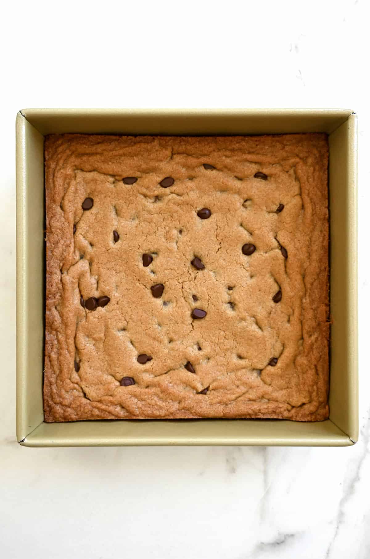 Baked cookie cake in a 9-inch baking pan.