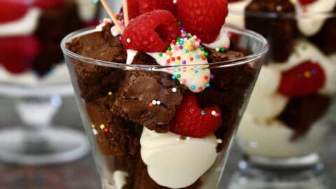 Brownie cocktail cakes with sprinkles in individual serving glasses.