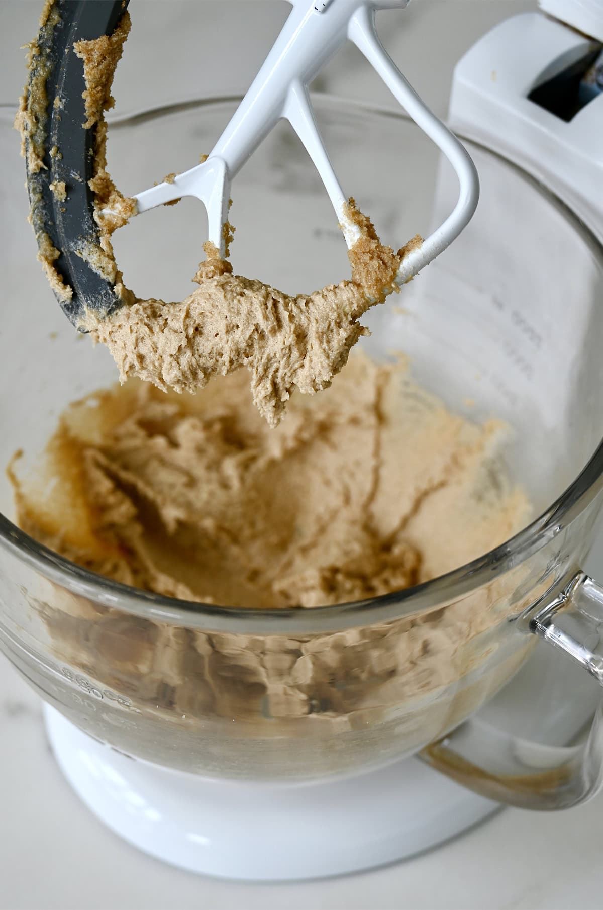Creamed butter and sugars in a stand mixer bowl.