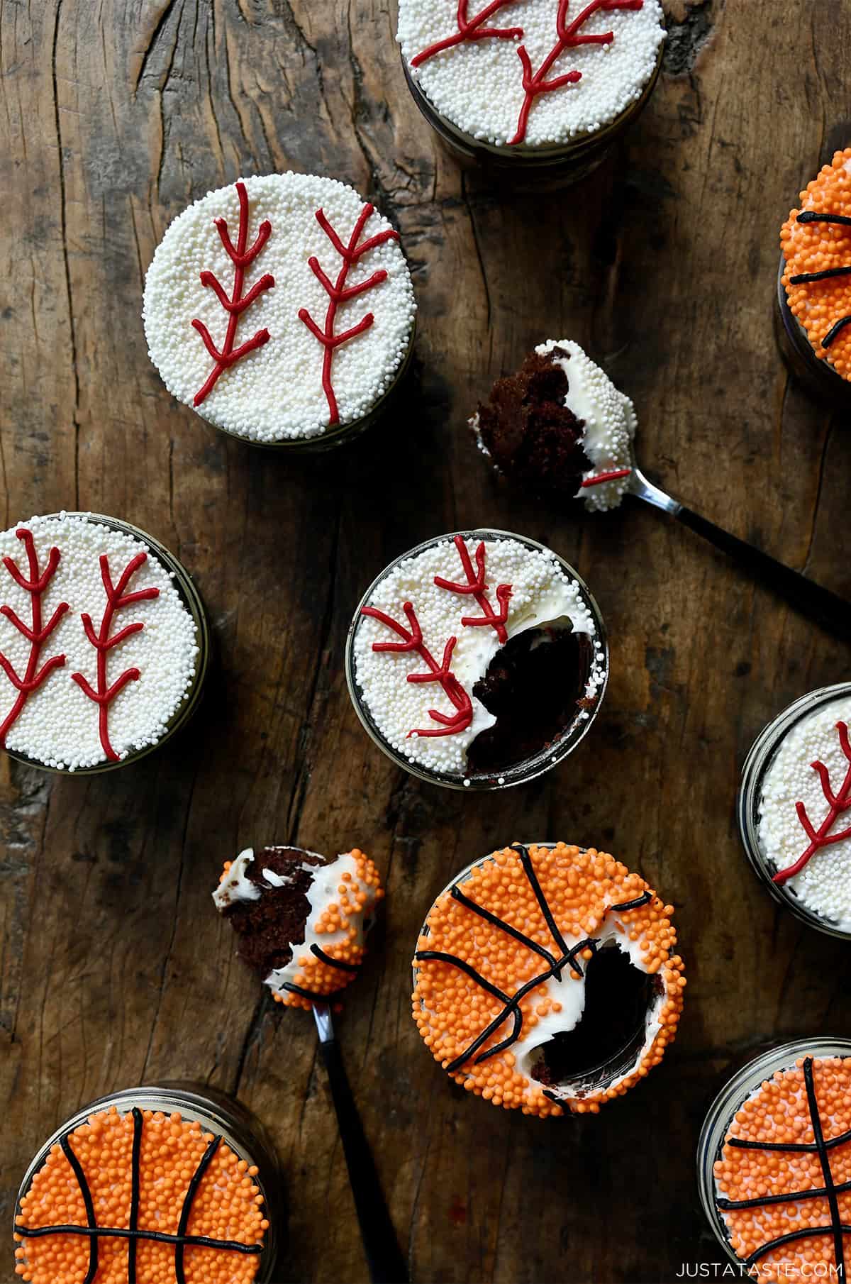 Dot cakes decorated to look like baseballs and basketballs.