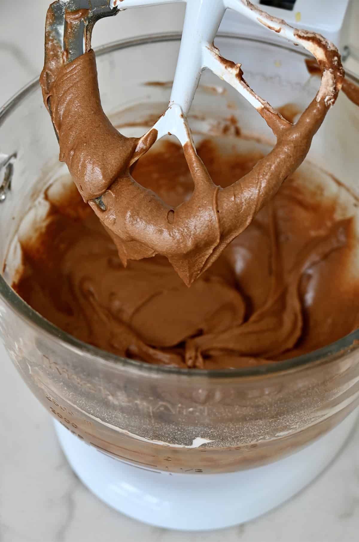 S'mores chocolate cake batter in a stand mixer bowl.