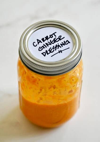 Homemade carrot-ginger dressing in a mason jar.