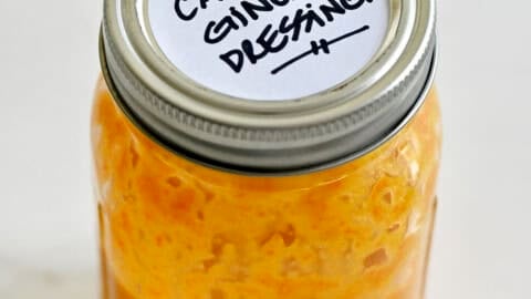 Homemade carrot-ginger dressing in a mason jar.