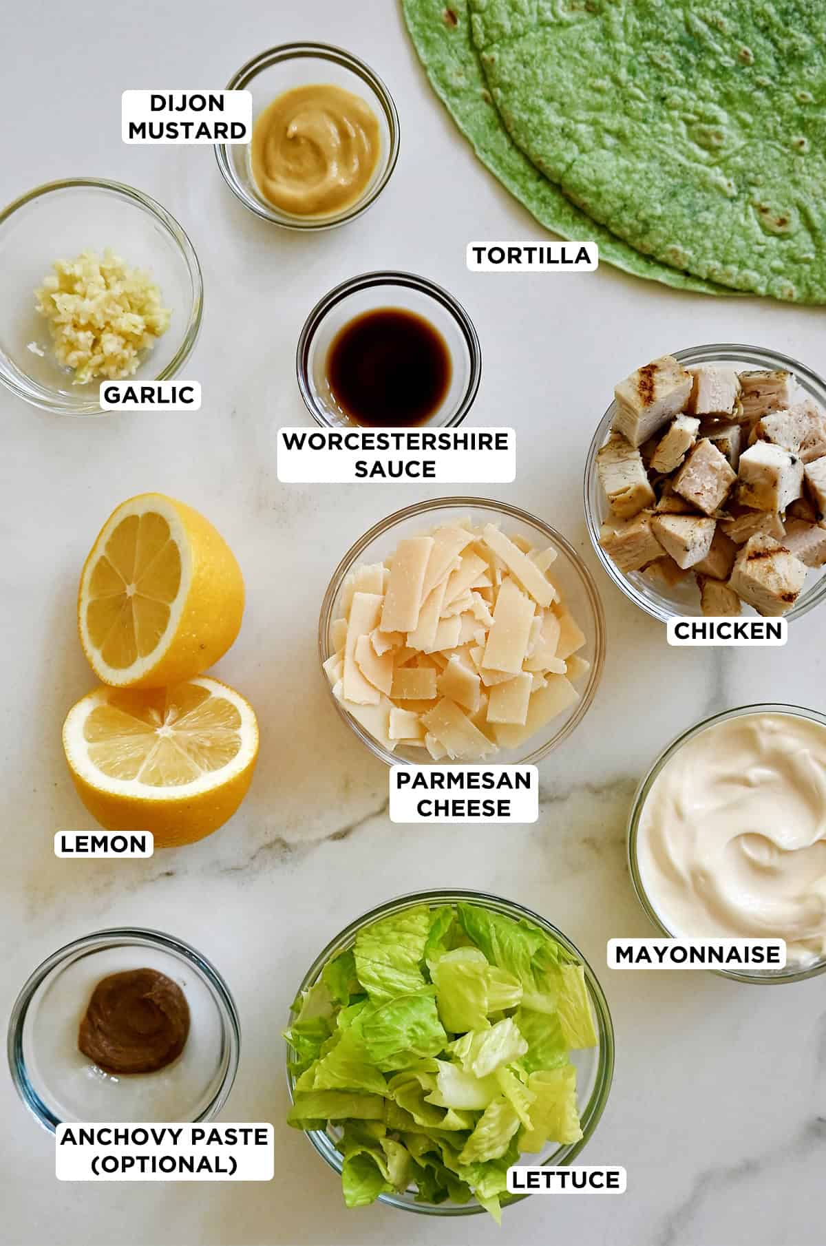 Ingredients to make a chicken Caesar salad wrap.