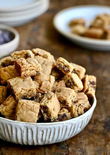 A bowl piled high with small chocolate chip cookie croutons.
