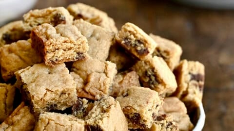 A bowl piled high with small chocolate chip cookie croutons.