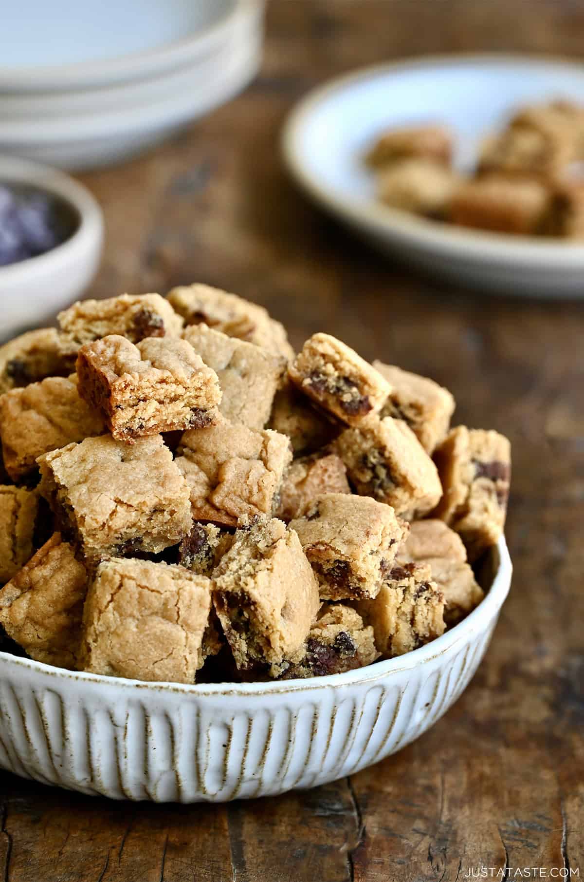 A bowl piled high with small chocolate chip cookie croutons.