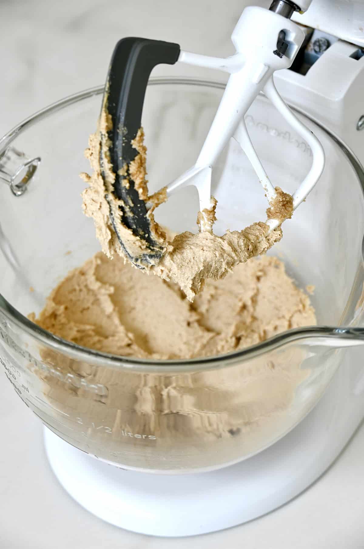 Creamed butter with white and brown sugars in a stand mixer bowl.