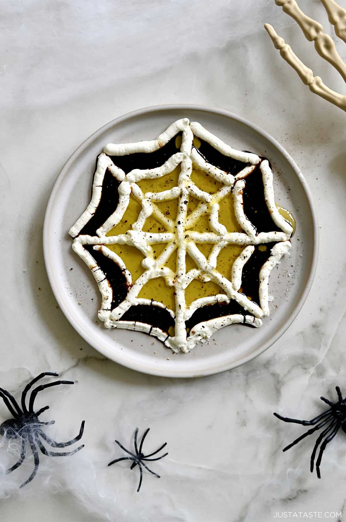 Cheese spider web, olive oil and balsamic vinegar dip.
