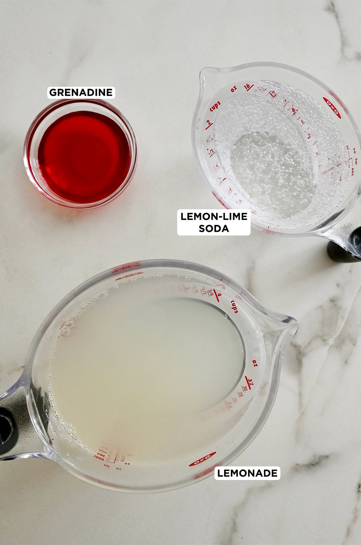 The three ingredients needed to make Halloween punch: grenadine, lemon-lime soda and lemonade.