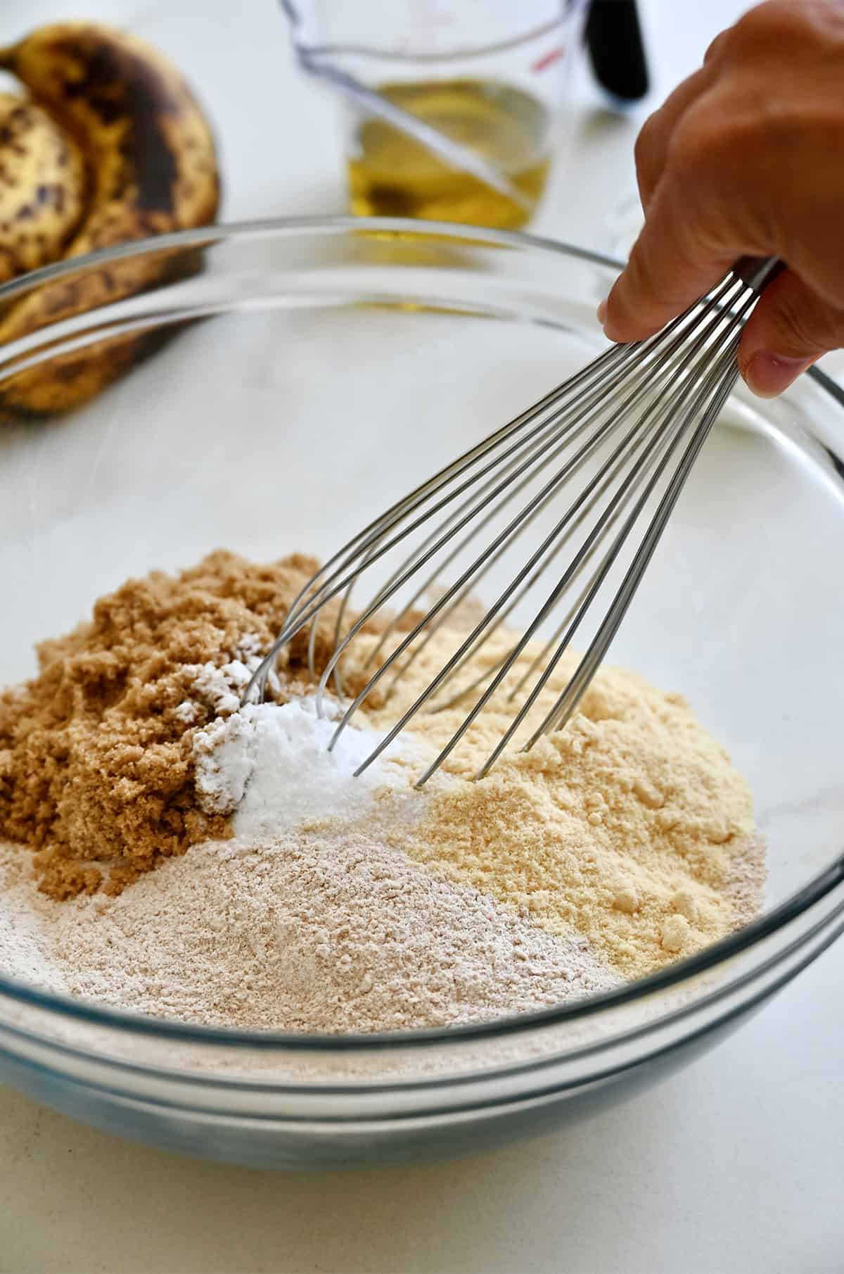 Dry ingredients in a large mixing bowl for protein muffins.
