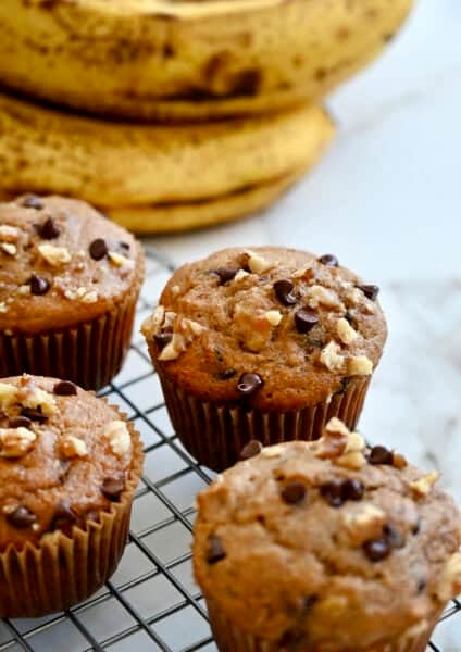 Protein banana muffins studded with chopped walnuts and chocolate chips.