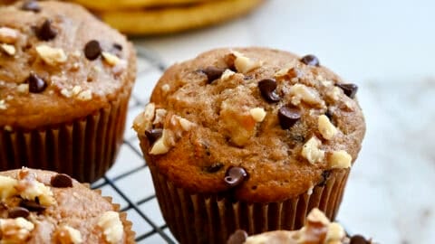 Protein banana muffins studded with chopped walnuts and chocolate chips.